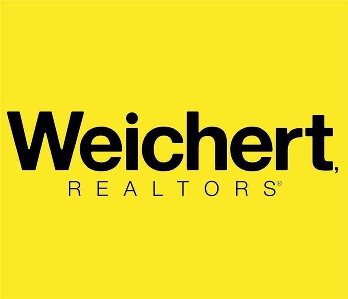 Weichert Realtors writing with yellow background