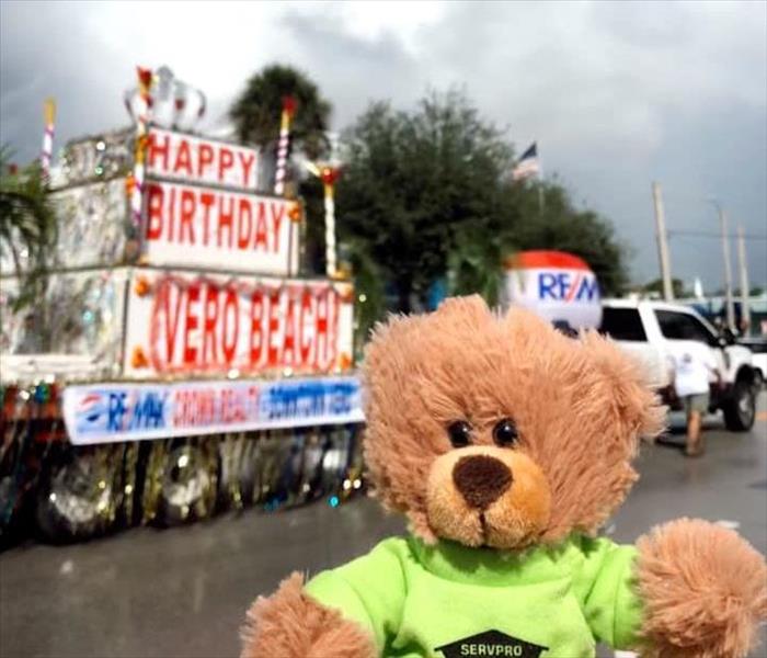 SERVPRO Teddy in a green shirt at Vero Beach parade