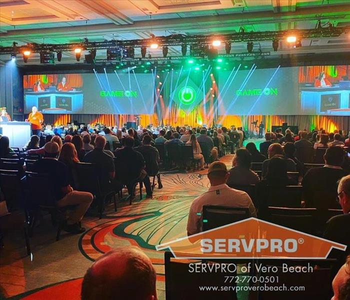 Convention room filled with Servpro franchise owners. 