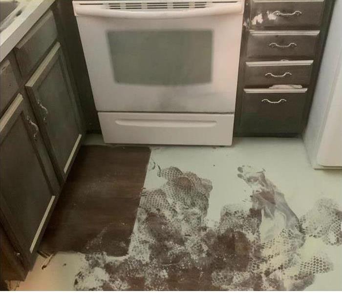 Powder residue from fire extinguisher on kitchen floor