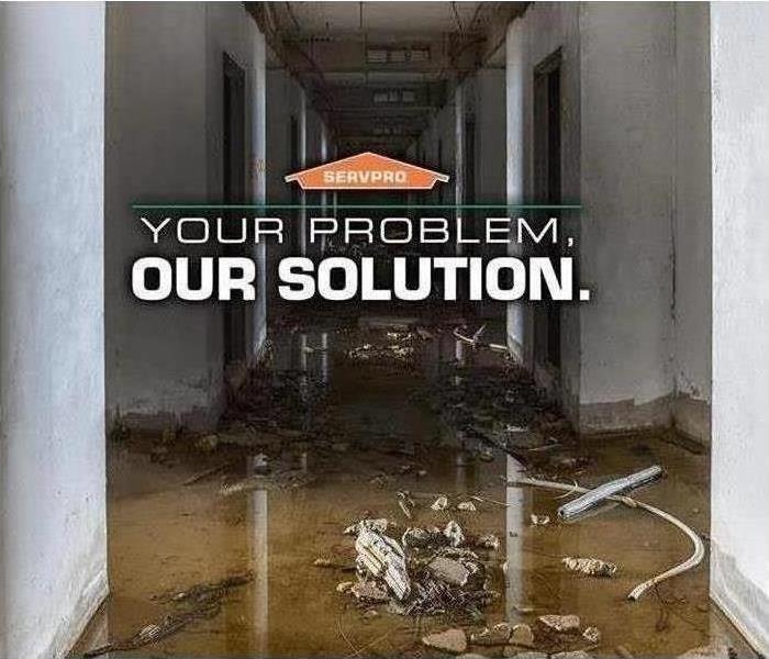 Flooded hallway with text that says “Your problem, our solution.”